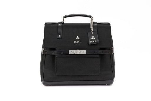 A black vegan Virginia Medical Bag In Black with a strap and a buckle by IYASU.
