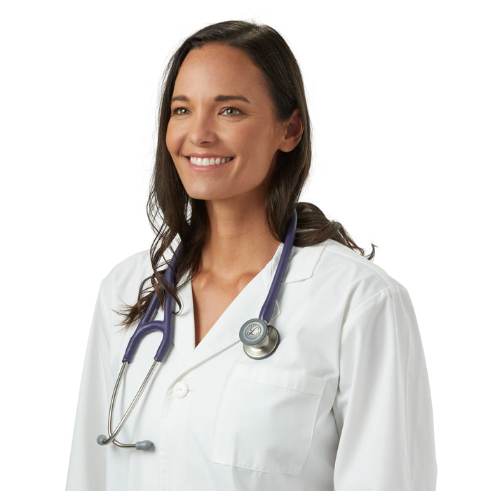 A smiling female healthcare professional wearing a white coat and a 3M™ Littmann® Cardiology IV Diagnostic Stethoscope: Satin Midnight Blue Tube 6187C around the neck, standing against a white background.